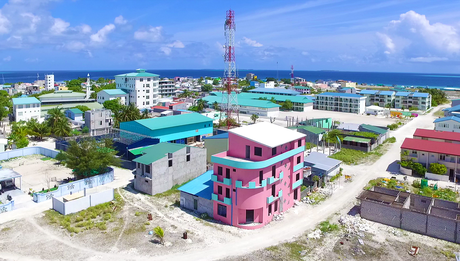 Aerial view of Naifaru island, Lhaviyani Atoll - the densely built 'island-city' with the sea behind